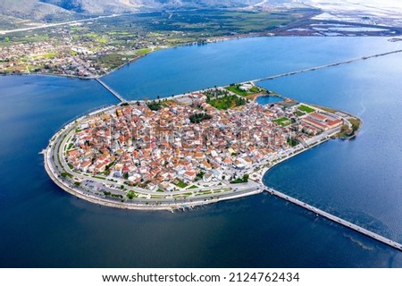 Aerial drone view of the famous island - fishing village of Aitoliko in Aetolia - Akarnania, Greece situated in the middle of Messolongi archipelago known as the Little Venice of Greece Royalty-Free Stock Photo #2124762434