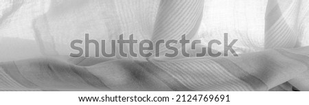 Monochrome gray silk fabric, Texture. Background. a photograph or picture developed or executed in black and white or in varying tones of only one color.