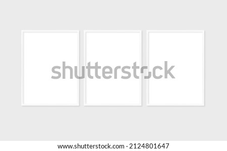 The layout of the set of 3 frame is 3x4, 30x40. Layout with 3 white frame. Clean, modern, minimalistic, bright. Portrait. Vertical. Royalty-Free Stock Photo #2124801647
