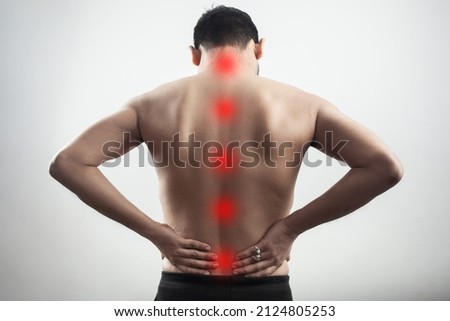 red highlight spot glow on back spine mark as a spinal cord injury or lumbar soreness Royalty-Free Stock Photo #2124805253