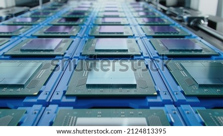Shot of Computer Processor Production Line at Advanced Semiconductor Foundry in Bright Environment. Microchip Factory. Royalty-Free Stock Photo #2124813395