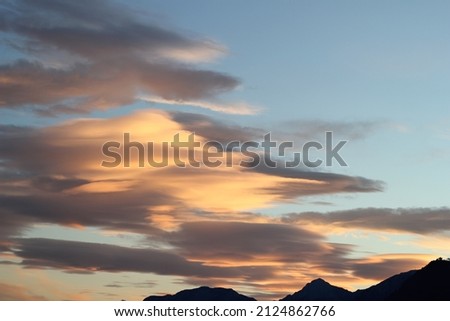 pastel clouds sunset with mountains selective focus landscape sky photo concept idea, pastel clouds sunset nature close up