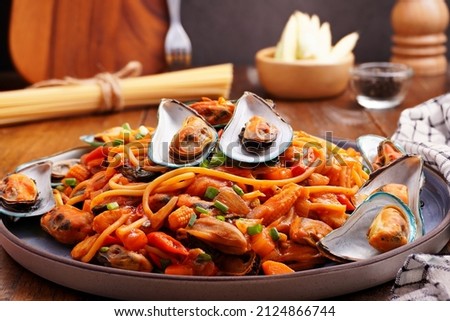 Mussel spaghetti, seafood, Italian style on wooden background