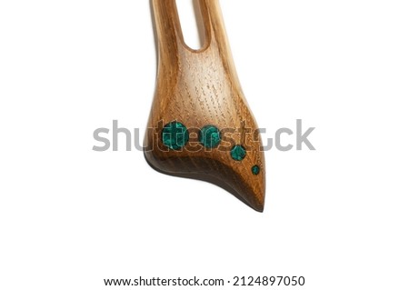 Photo of a woman's wooden hairpin on a white background. Object shooting. Content for jewelry and accessories website. A perfect gift for your girlfriend, sister or mother.