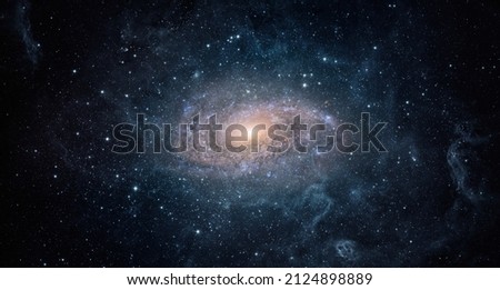 View from space to a spiral galaxy and stars. Universe filled with stars, nebula and galaxy,. Elements of this image furnished by NASA. Royalty-Free Stock Photo #2124898889