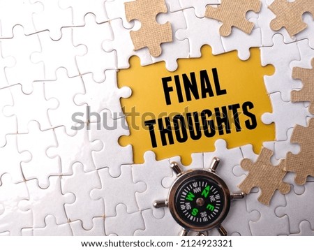 Selective focus.Top view compass with text FINAL THOUGHTS on a white puzzle background. Royalty-Free Stock Photo #2124923321
