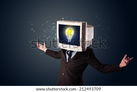Business man with a pc monitor head and idea light bulb glowing in the display