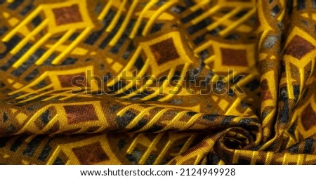 Thick cotton fabric with diamond print on yellow lines. On a gray background. Texture. Drawing. abstract geometric pattern with yellow, gray, brown diagonal, zigzag stripes, geometric background