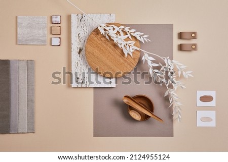 Creative flat lay composition with textile and paint samples, panels and cement tiles. Stylish interior designer moodboard. Light beige color palette. Copy space. Template.  Royalty-Free Stock Photo #2124955124