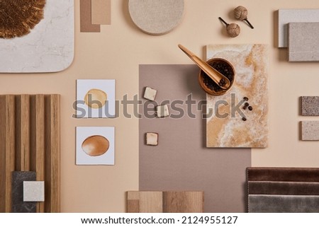Flat lay of stylish architect moodboard composition with beige samples of textile, paint, wooden lamella panels and tiles. Top view. Copy space. Template.