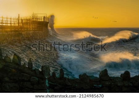 Waves start to increase as Storm Eunice gathers momentum around Porthcawl lighthouse in South Wales UK
 Royalty-Free Stock Photo #2124985670