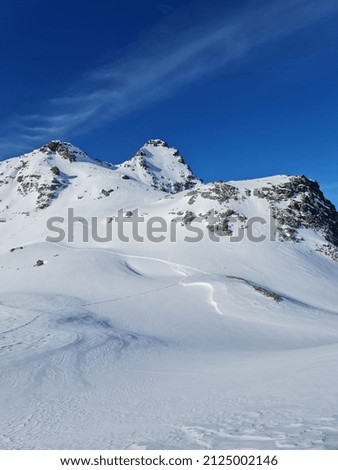 Scenic view to high peaks of Alps in winter.
