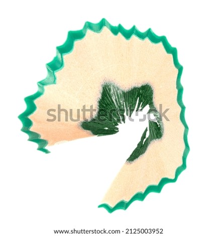 Green pencil shavings isolated on white background. closeup