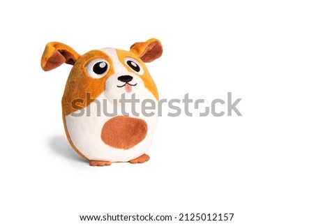 Cute jack russell dog doll isolated on white background. Close-up of a stuffed dog toy.
