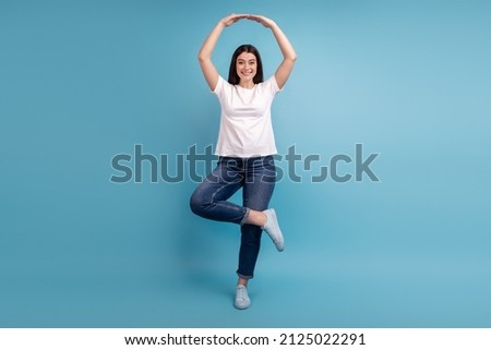 Full length photo of young attractive woman elegance ballerina dance isolated over blue color background