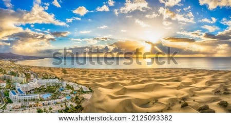 Landscape with Maspalomas town and golden sand dunes at sunrise, Gran Canaria, Canary Islands, Spain Royalty-Free Stock Photo #2125093382