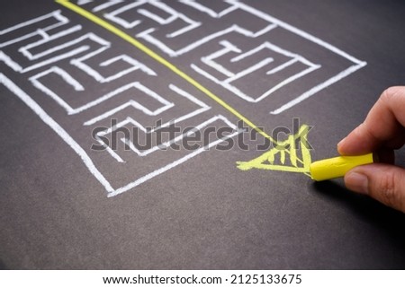 Hand draw a shorten straight way to go through the complication of a maze game, easier process, simplify in communication, or fast solution concept Royalty-Free Stock Photo #2125133675