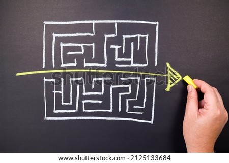 Hand draw a shorten straight way to go through the complication of a maze game, easier process, simplify in communication, or fast solution concept Royalty-Free Stock Photo #2125133684