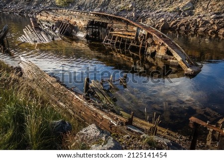 Old destroyed wooden ship in the arctic, Teriberka, Russia