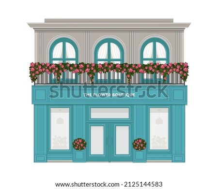 Flower boutique. Facade of a flower shop. florist shop facade decorated with flowers. Vintage boutique. Building with a balcony decorated with flowers Royalty-Free Stock Photo #2125144583