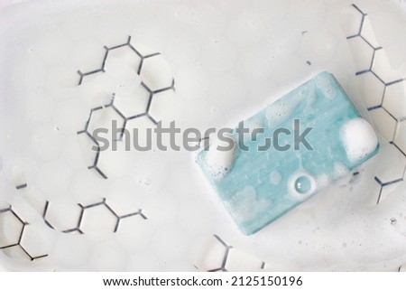 Soap bar and foam on white background, top view. Mockup for design Royalty-Free Stock Photo #2125150196
