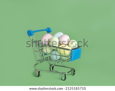 Colorful eggs in a shopping card .Holiday sale .Easter