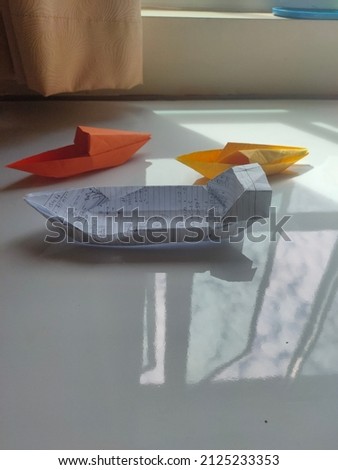 This my boat paper craft art. There are three boat papers in this art. It contains yellow, orange and white color.  