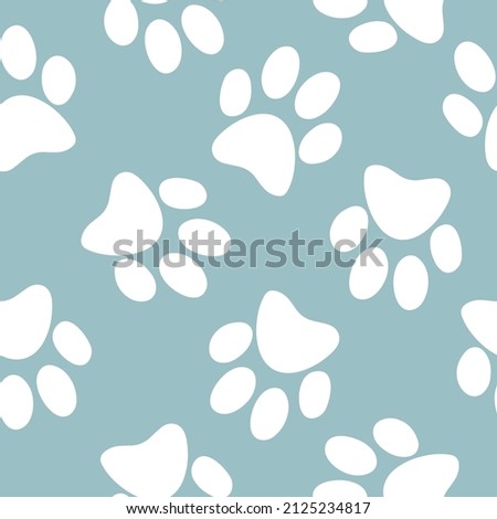 Seamless pattern with paw prints of pets, dogs, cats. Animal trail. Silhouettes of paws. Doodle dog paws seamless blue background. Cute and funny cartoon style. Pet shop. Veterinary. 
