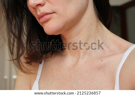 age-related changes in the face, neck and décolleté, age spots, wrinkles, skin aging Royalty-Free Stock Photo #2125236857