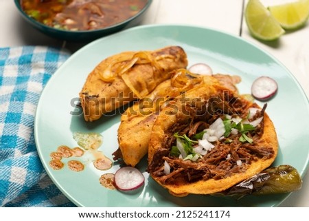 Beef birria tacos with sauce. Traditional mexican food