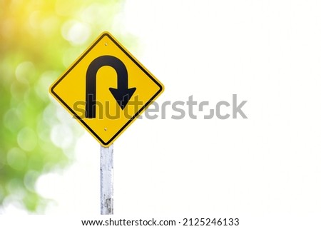 Right u turn traffic sign with blurred bokeh background.