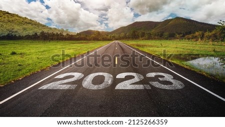 2023 written on highway road in the middle of empty asphalt road and beautiful blue sky. Concept for vision new year 2023. future vision 2023 Royalty-Free Stock Photo #2125266359