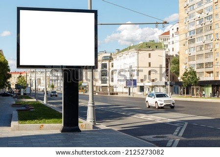 Blank large billboard in a residential area of the city. Mock-up.