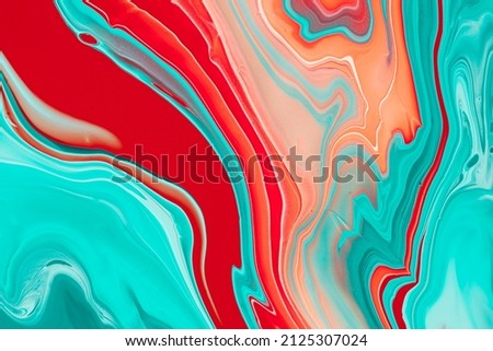 Liquid style background of colored blending paints. Fluid art texture of colorful swirls and mixtures of wavy colorants. Abstract rippled backdrop of inks that were blended between themselves.
