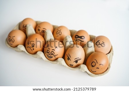 Chicken eggs with drawn face emotions. prepare to easter