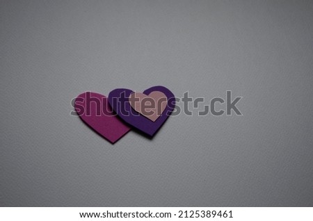 Beautiful cute hearts on table flat lay composition. Valentines Day greeting card concept. Mothers Day anniversary design.