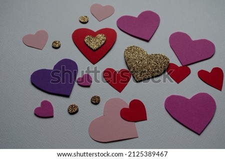 Beautiful cute hearts on table flat lay composition. Valentines Day greeting card concept. Mothers Day anniversary design.