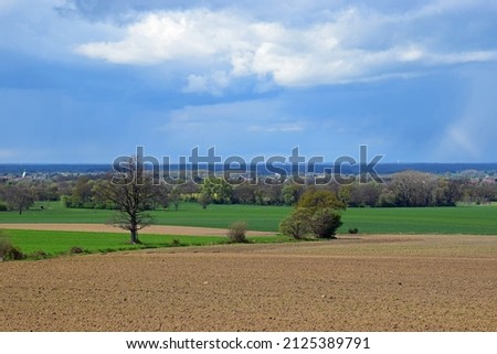 Spring landscape with fields and a cloudy sky in Schaumburg 