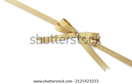 Golden satin ribbon with bow on white background, top view Royalty-Free Stock Photo #2125421033