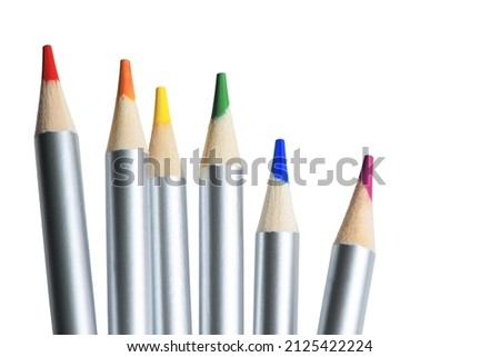 Color pencils isolated on white background. Six colour pencils in LGBT rainbow colors. Closeup. Copy space