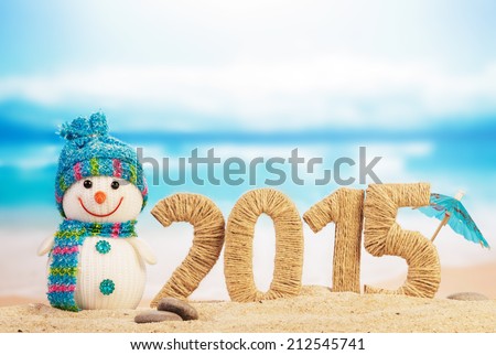New year 2015 sign with snowman on beach background Royalty-Free Stock Photo #212545741