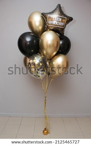 Set of golden and black balloons, "Happy Birthday" star lettering, birthday decor