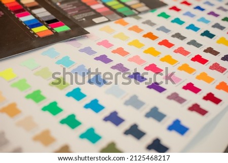 Choosing T-shirt color selection for marketing advertising business textile fabric clothes production. Litho serigraphy