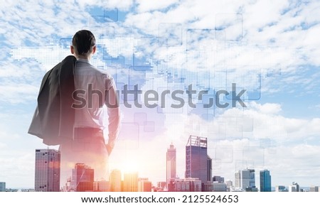 Double exposure of elegant businessman with jacket on shoulder looking away