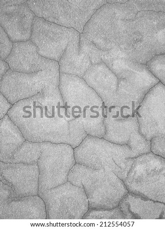 crack on aged gray cement wall background