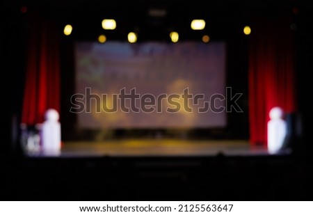 Texture blur and defocus, background for design. Stage light at a concert show. Artists perform on scene in light and smoke.