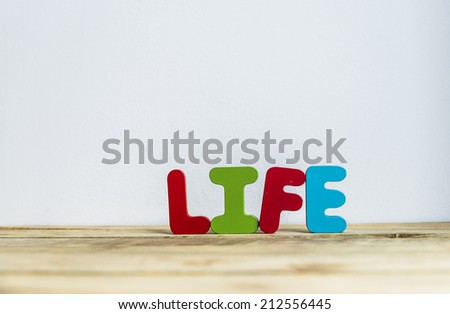 Colorful wooden word Life with white background