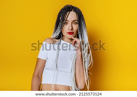 Mesmerizing Portrait of Beautiful Woman with Dreadlocks and a Mysterious Finger Pose, Perfect for Marketing and Advertising Campaigns to Grab Attention and Boost Sales