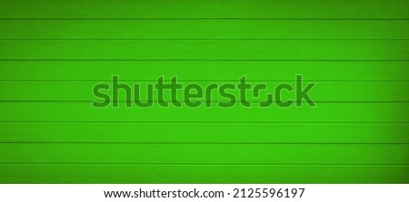 Abstract grunge old neon green painted wooden texture - wood board background panorama banner.	
