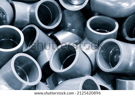 Grey pvc plumbing pipes corners background closeup Royalty-Free Stock Photo #2125620896